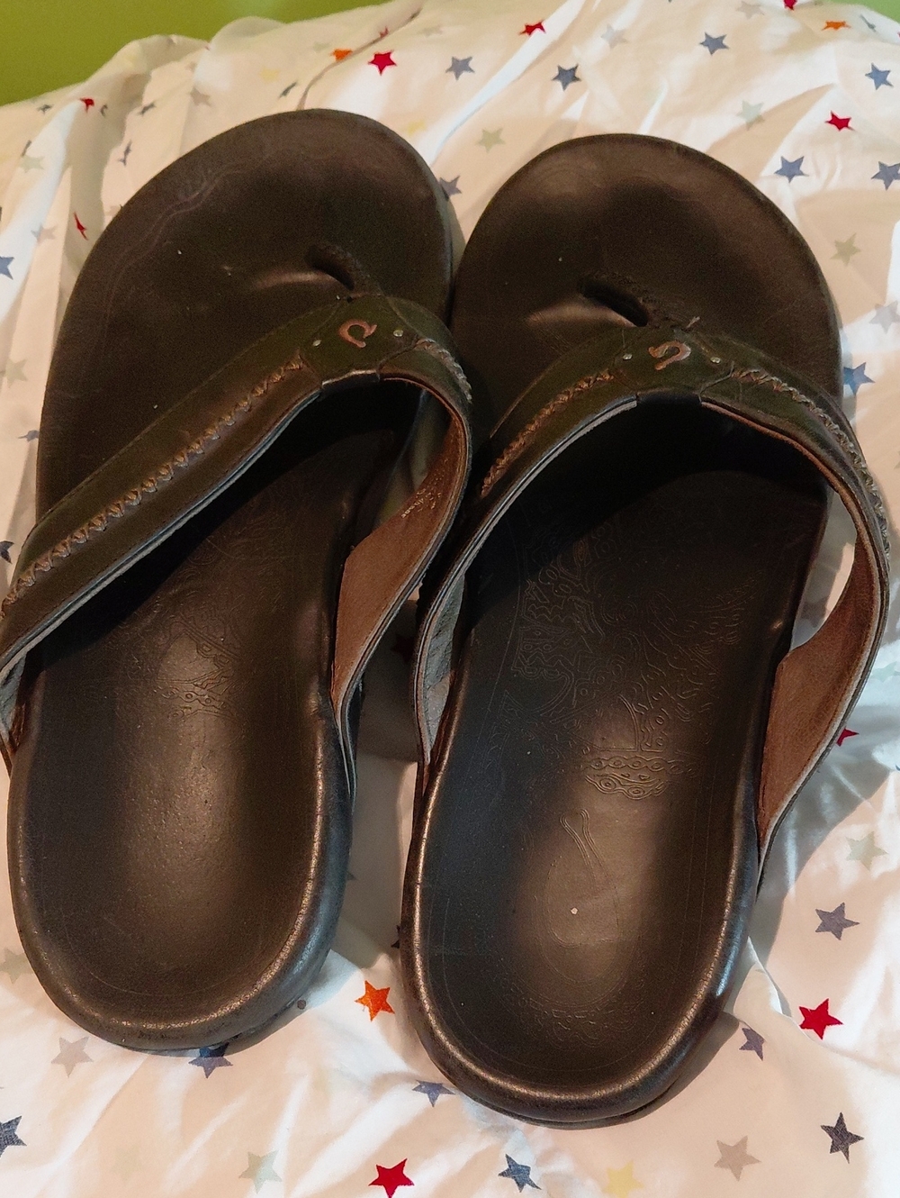 OluKai Men's Black and Brown Leather Flip Sandals
